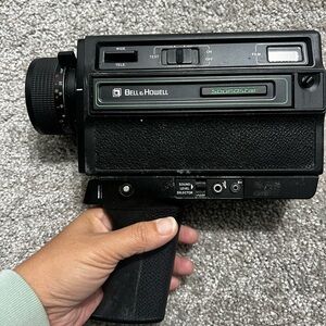 Bell & Howell Black Video Camera- turns on and moves film but makes noise on